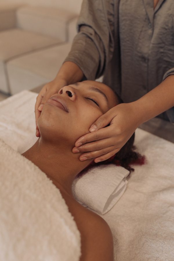 Masseuse Massaging Woman's Face